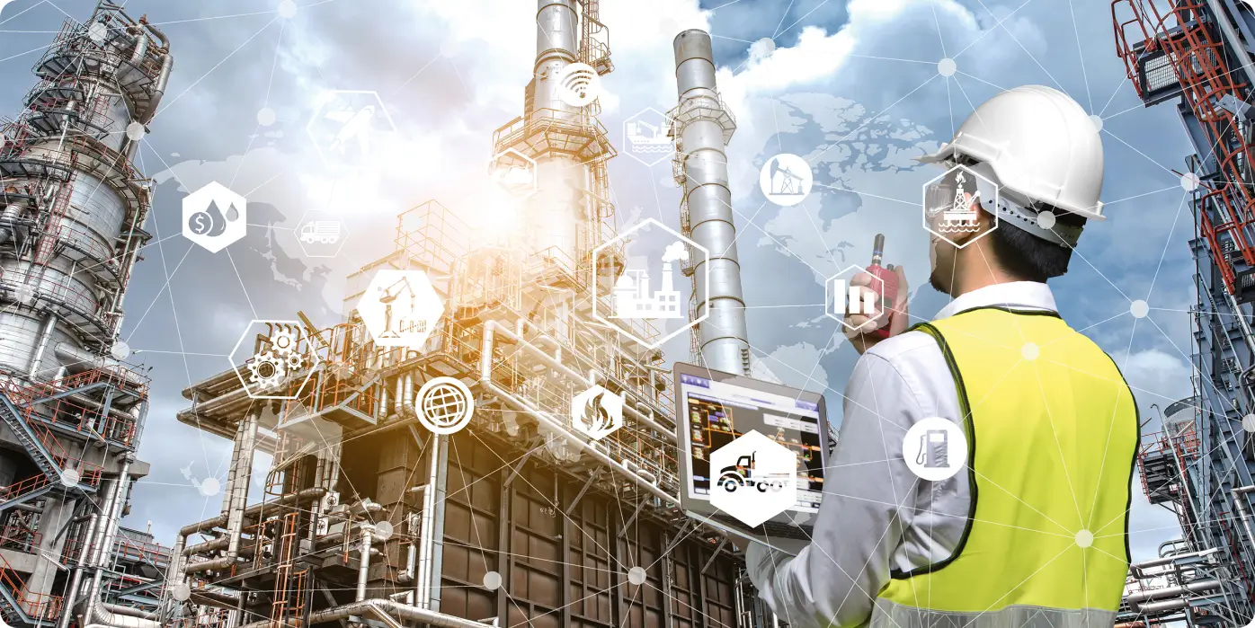 An engineer wearing a safety helmet and reflective vest holding a tablet in an industrial refinery complex, with digital icons symbolizing industry, technology and energy connections.